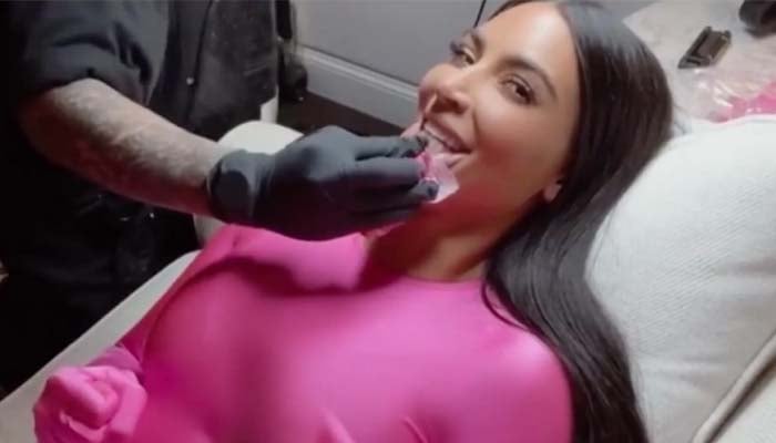 File Footage Kim Kardashian is getting her tattoo done