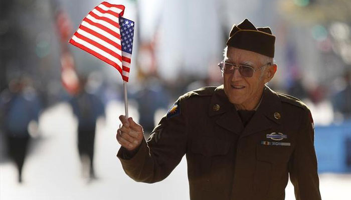 A veteran marches up 5th Avenue during the Veterans Day Parade in New York on November 11, 2012.—Reuters