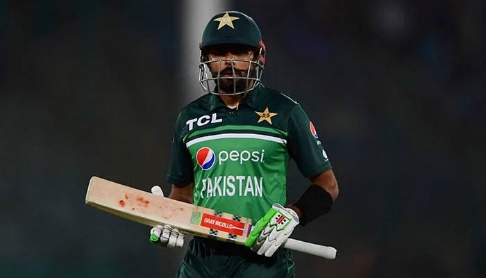 Pakistan captain Babar Azam returns to the stand after being dismissed during the second ODI cricket match between Pakistan and New Zealand at the National Stadium in Karachi on January 11, 2023. — AFP