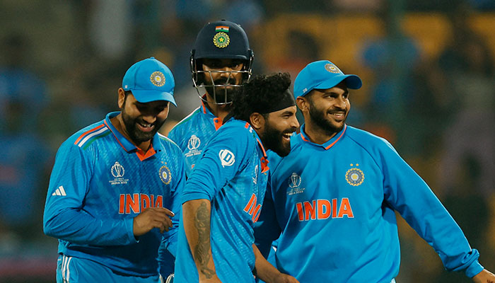 Indias Ravindra Jadeja celebrates with teammates after taking the wicket of Netherlands Roelof van der Merwe during the World Cup 2023 match at Bengalurus M Chinnaswamy Stadium on November 12, 2023. — Reuters