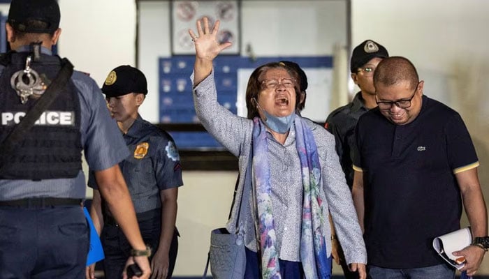 Former Philippines senator Leila de Lima waves as she walks out of the Philippine National Police custodial center after being granted bail following over six years in detention, at Quezon City, Philippines, November 13, 2023.—Reuters