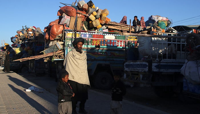 Muhammad Yaqoob, 55, an Afghan national with his children stands with trucks loaded with belongings as they head back to Afghanistan from Pakistan, at the Chaman Border Crossing along the Pakistan-Afghanistan Border in Balochistan, in Chaman, Pakistan November 10, 2023. — Reuters