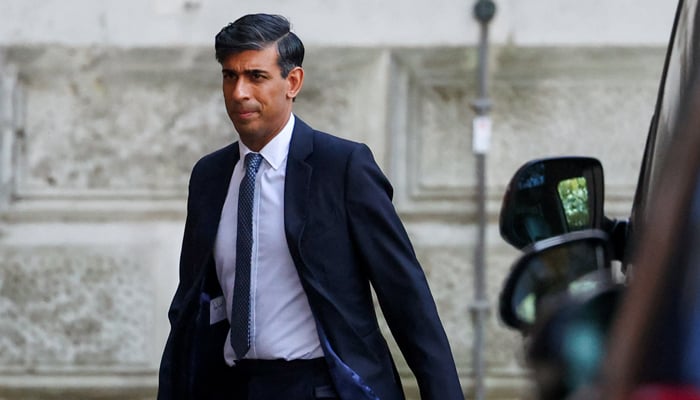 Britains Prime Minister Rishi Sunak walks outside 10 Downing Street in London, Britain November 13, 2023. — Reuters