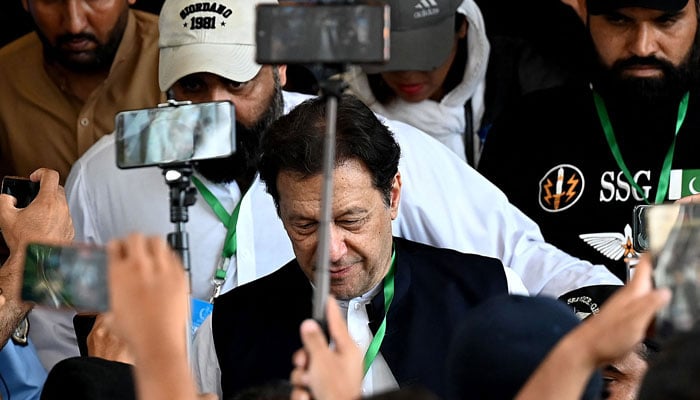 Pakistan´s former Prime Minister Imran Khan (C) leaves after appearing in the Supreme Court in Islamabad on July 26, 2023. — AFP