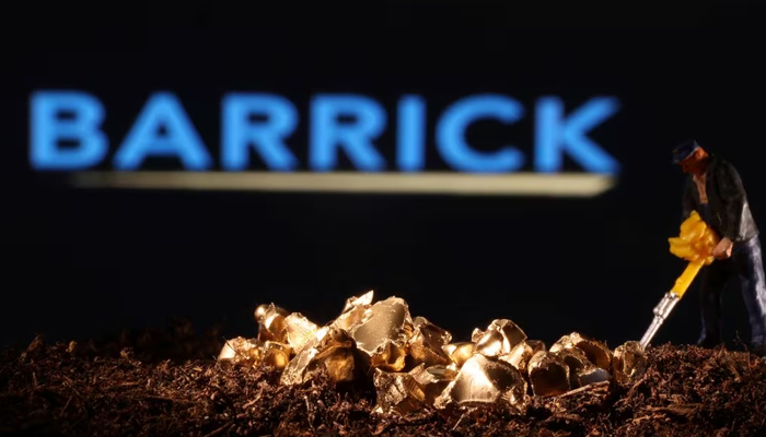A small toy figure and gold imitation are seen in front of the Barrick logo in this illustration taken November 19, 2021. — Reuters