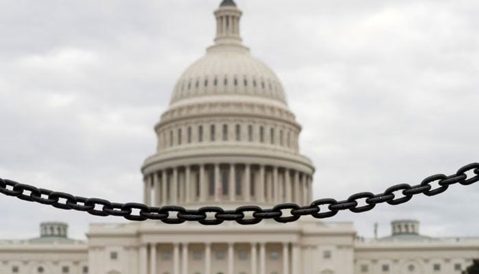 The dome of the US Capitol is seen beyond a chain fence during the partial government shutdown in Washington, US, January 8, 2019. —Reuters