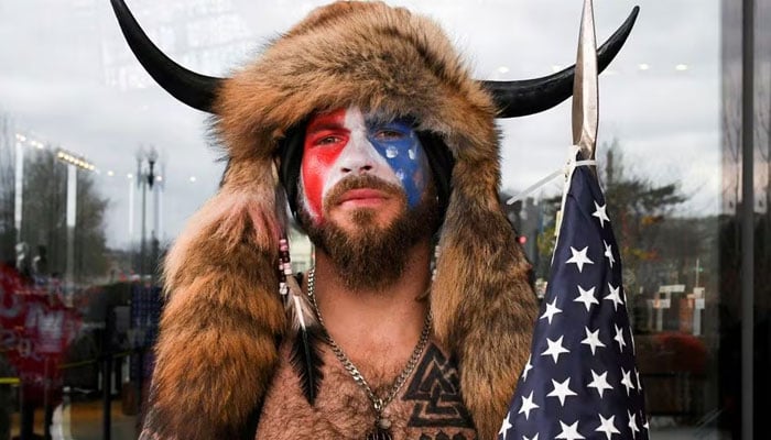 Jacob Anthony Chansley of Arizona poses with his face painted in the colors of the U.S. flag as supporters of U.S. President Donald Trump gather in Washington, U.S., January 6, 2021. —Reuters