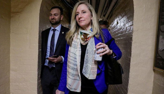 US Representative Abigail Spanberger walks through an underground tunnel on her way to the House floor.—Reuters