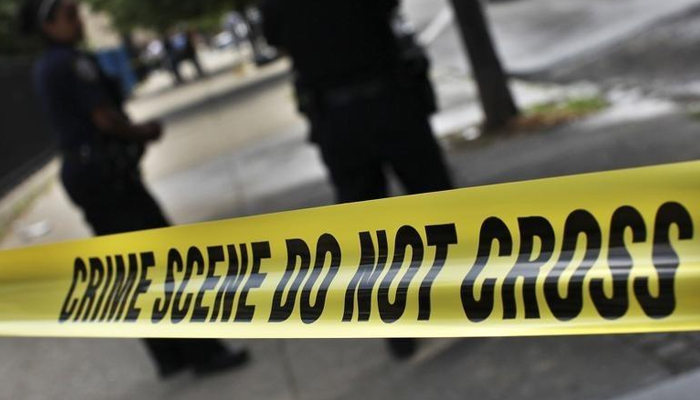 NYPD crime scene tape is seen at the site of a shooting in Brooklyn, New York July 9, 2012. — Reuters
