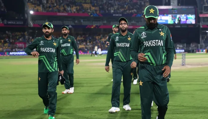 Babar Azam walks (1st right) back with the team after defeat against Afghanistan. — AFP/File