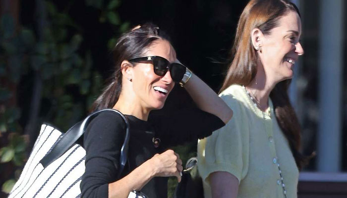 Meghan Markle acts like delighted C-lister after getting caught on camera