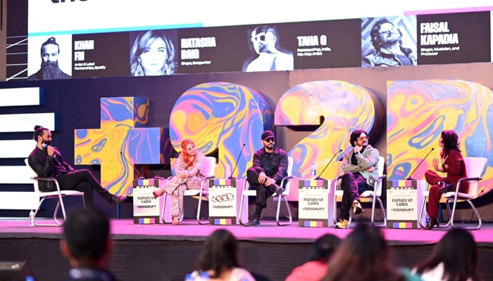Panellists talk on the stage at the +92Disrupt. — supplied