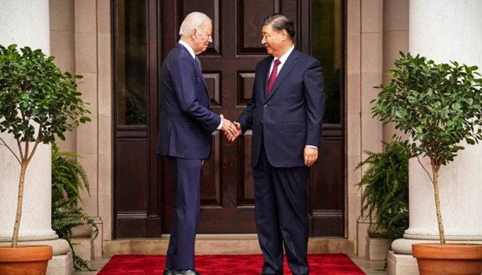 US President Joe Biden greets Chinese President Xi Jinping before a meeting during the Asia-Pacific Economic Cooperation (APEC) Leaders week. —AFP