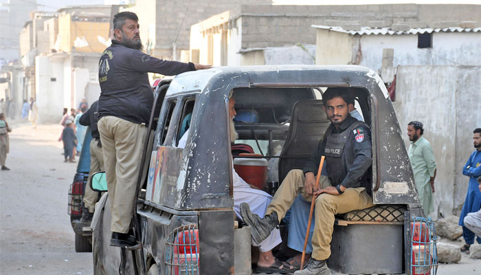 Police personnel patrol in Karachi on October 2, 2023. — Online
