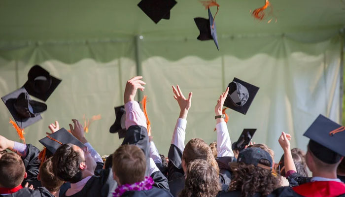 A representational image of students celebrating their graduation ceremony. — Pexels