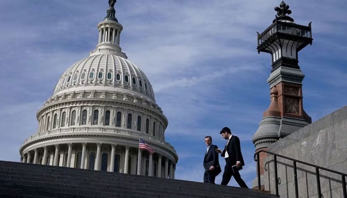 People walk past the US Capitol building in Washington, US, November 15, 2023. —Reuters