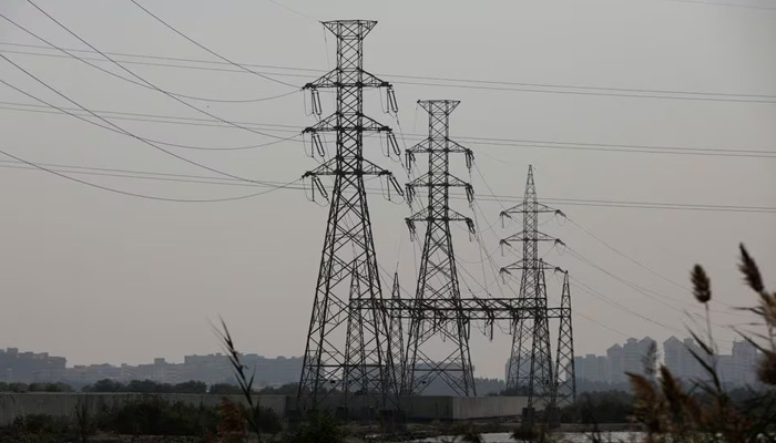 An electricity transmission tower is seen a day after a nationwide power outage in Karachi on January 24, 2023. — Reuters