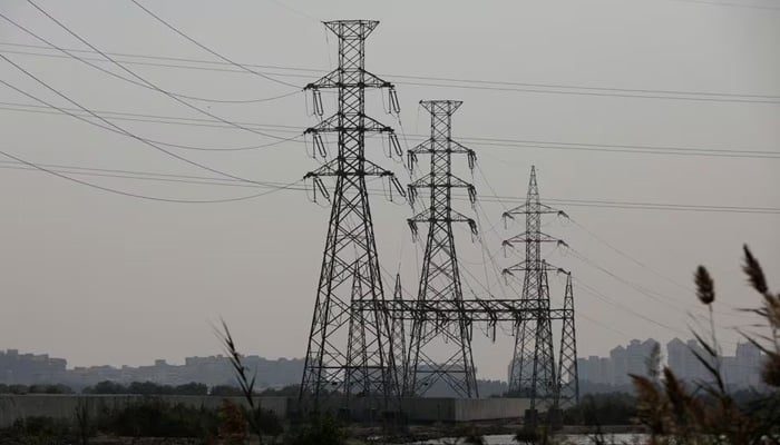 A power transmission tower is seen a day after a country-wide power breakdown in Karachi on January 24, 2023. — Reuters