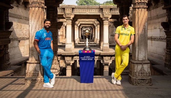 India captain Rohit Sharma and Australia captain Pat Cummins pose for a photo with the World Cup 2023 trophy. — ICC