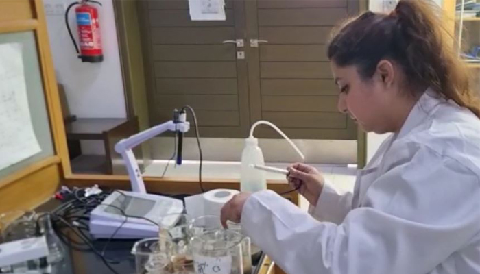Nayab conducts an experiment at a lab. — Photo via Nayab