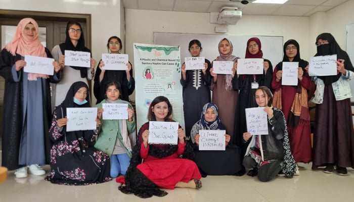 Mehreen poses with girls after a training session on menstruation. — Photo via Mehreen