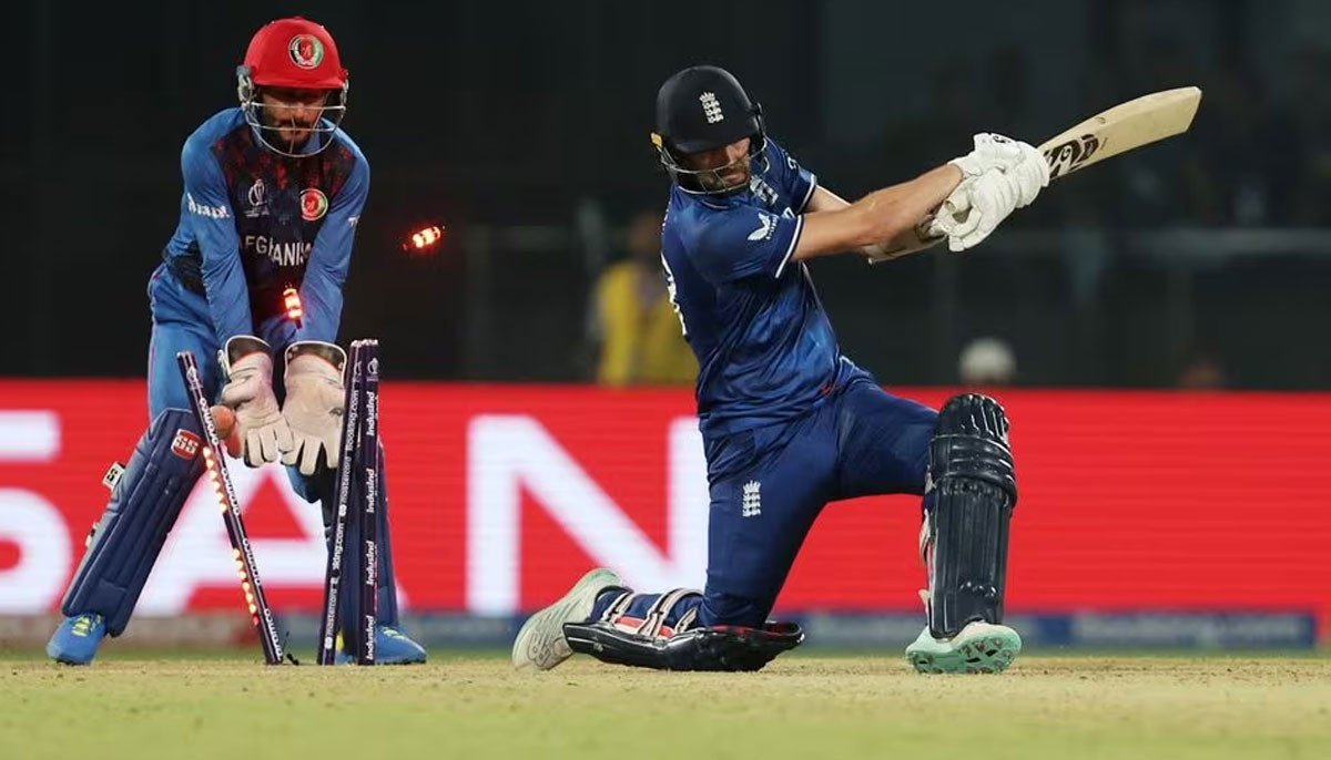 Cricket - ICC Cricket World Cup 2023 - England v Afghanistan - Arun Jaitley Stadium, New Delhi, India - October 15, 2023 Englands Mark Wood gets bowled out by Afghanistans Rashid Khan as England lose to Afghanistan. —Reuters