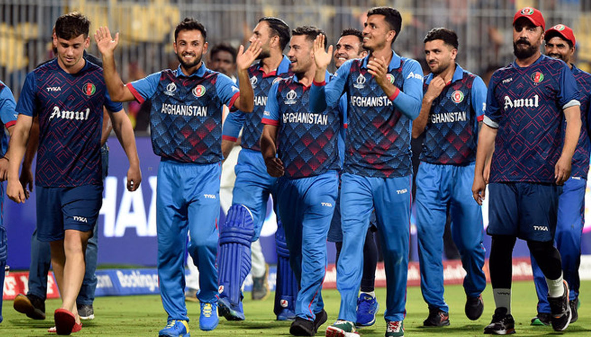 Afghanistan players and staff celebrate after winning the match against Pakistan at MA Chidambaram Stadium in Chennai, India, on October 23, 2023..—Reuters