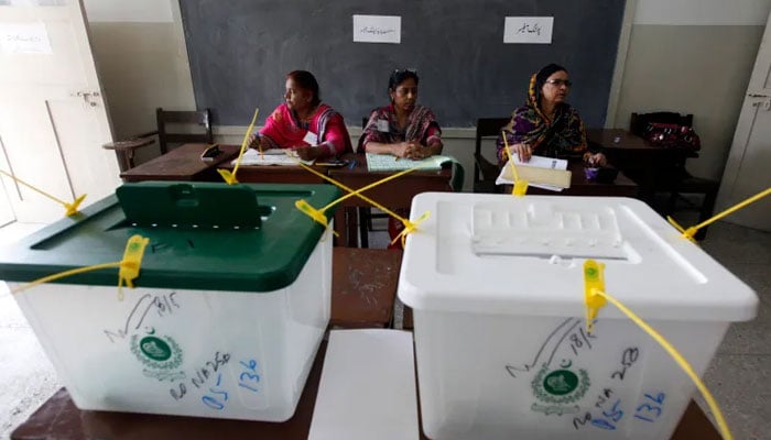 Polling officials during an election in Pakistan can be seen in this undated image. — Reuters/File