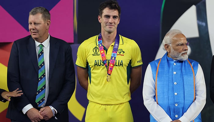 Australia's Pat Cummins with Indian Prime Minister Narendra Modi and Australian Deputy Prime Minister Richard Marles after winning the ICC Cricket World Cup.  — Reuters