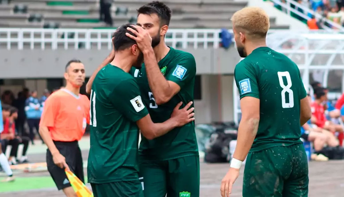 Pakistani players celebrate winning a qualifying match in Saudi Arabia. — FIFA