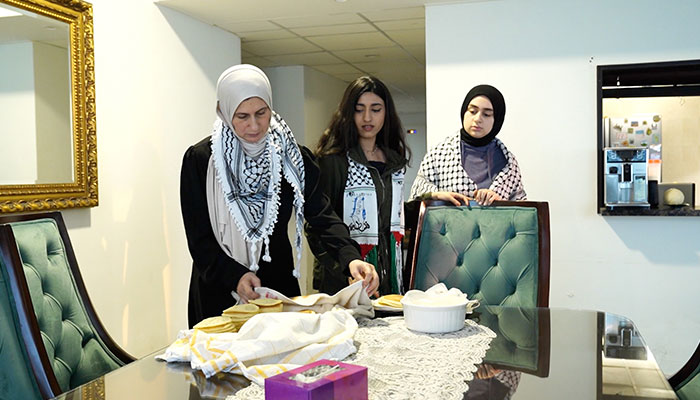 Iman Al Haj Ali with her daughters Laila and Israh at their home-based bakery in Karachi. — Author