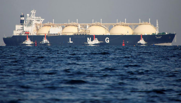 A liquefied natural gas (LNG) tanker is tugged towards a thermal power station in Futtsu, east of Tokyo, Japan, on November 13, 2017. — Reuters