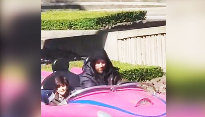 Inter Miami superstar soccer player Lionel Messi (right) is driving a theme park car at Disneyland Paris in this still taken from a video. X/ @M30Xtra/File