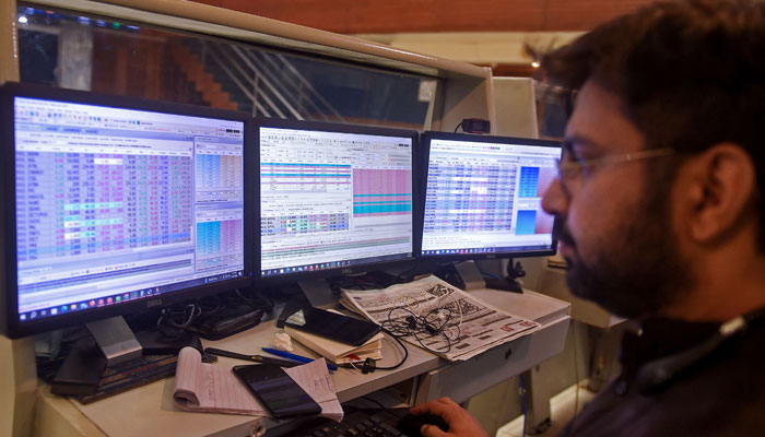 A stockbroker looks at a computer during a trading session at the Pakistan Stock Exchange (PSX) in Karachi on July 31, 2023. — AFP