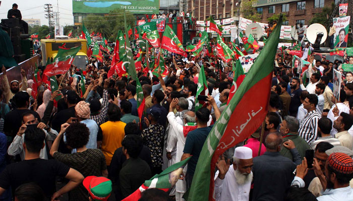 A large numbers of supporters of Tehreek-e-Insaf (PTI) are holding rally on the occasion of International Labour Day to show solidarity with laborers and to stand for the supremacy of the constitution, at Liberty Chowk in Lahore on Monday, May 1, 2023. — AFP