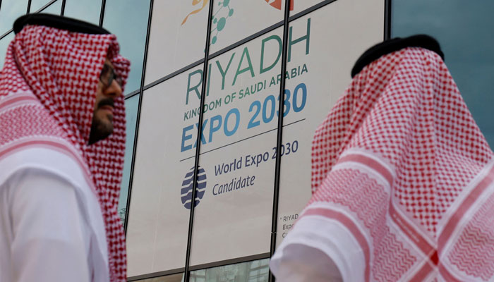 Attendees wearing traditional dress arrive at the Grand Palais Ephemiere for the Riyadh 2030 reception event to promote Riyahd´s candidacy for 2030 World Expo, in Paris on June 19, 2023. — AFP