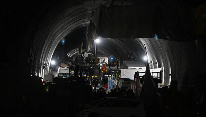 Rescue personnel pictured at the entrance to the tunnel.—AFP