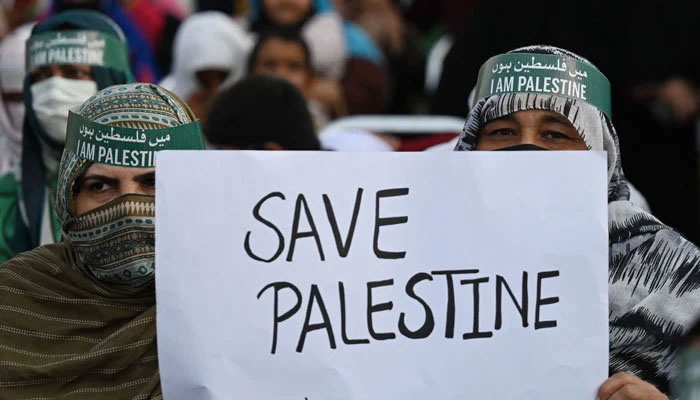 Supporters of Pakistan Markazi Muslims League (PMML) take part in a rally to express their solidarity with Palestinians, in Islamabad on October 13, 2023. — AFP
