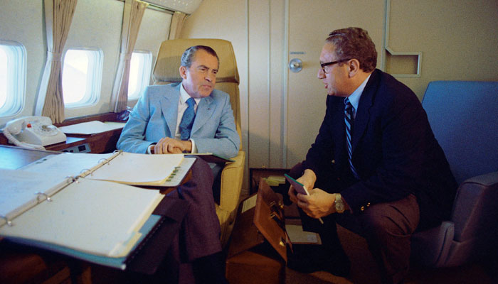 US President Richard Nixon and National Security Adviser Henry Kissinger speak on Air Force One during their voyage to China February 20, 1972. Reuters/Richard Nixon Presidential Library/Handout