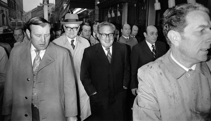 US Secretary of State Henry Kissinger walks in the street in Paris on February 19, 1975. — AFP