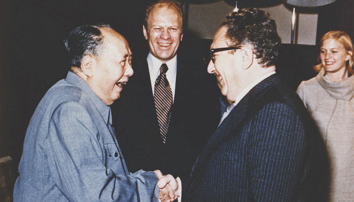 US President Gerald Ford and his daughter Susan watch as US Secretary of State Henry Kissinger shakes hands with Mao Tse-Tung, Chairman of the Chinese Communist Party, during a visit to the Chairmans residence in Beijing, China, December 2, 1975. — Reuters