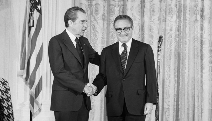 US President Richard Nixon congratulates Henry Kissinger after he was sworn in as secretary of state in a ceremony in the White House on September 22, 1973. — CGTN/VCG Photo