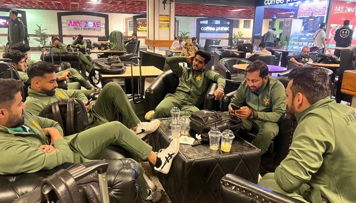 Members of the Pakistan squad at the Lahore airport before their departure for Australia. — PCB