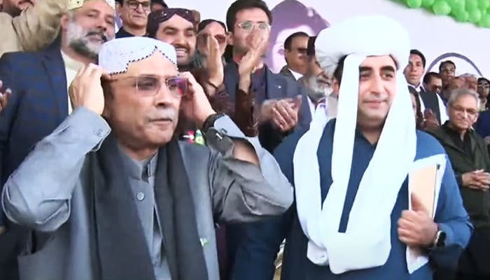 PPP leaders Asif Ali Zardari (left) and Bilawal Bhutto-Zardari celebrate PPPs 56th foundation at a rally in Quetta in this still taken from a video on November 30, 2023. — YouTube/GeoNews