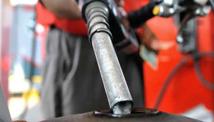 A petrol pump attendant is filing motorbike fuel tank in this undated image. — APP/File