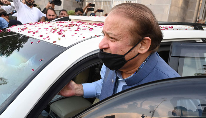 Former prime minister Nawaz Sharif entering his car after appearing before the Islamabad High Court. — AFP/File
