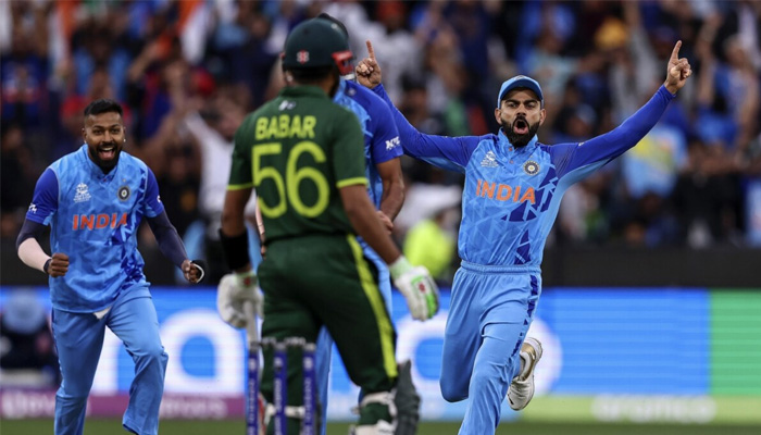 Indian cricketers celebrate after dismissing former Pakistan skipper Babar Azam in a T20 World Cup match. — AFP/File