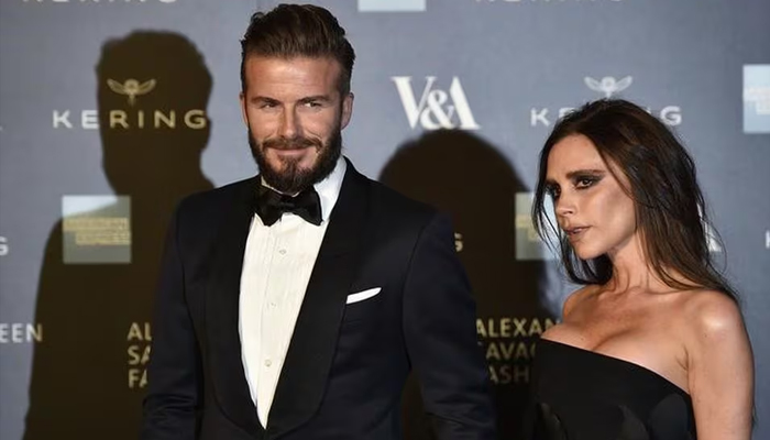 David Beckham and wife Victoria Beckham attending an event. — Reuters