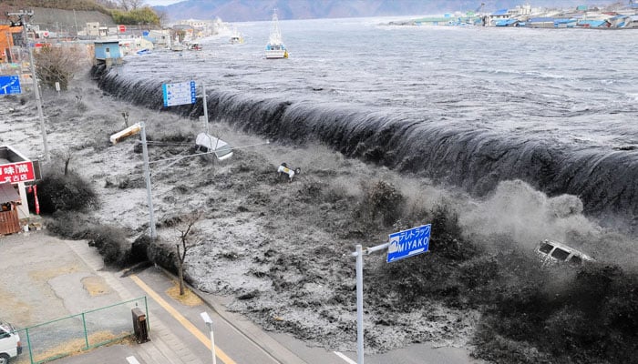 A tsunami reaches Miyako City, overtopping seawalls and flooding streets in Iwate Prefecture, Japan, after the magnitude 9.0 earthquake struck the area March 11, 2011. — Reuters