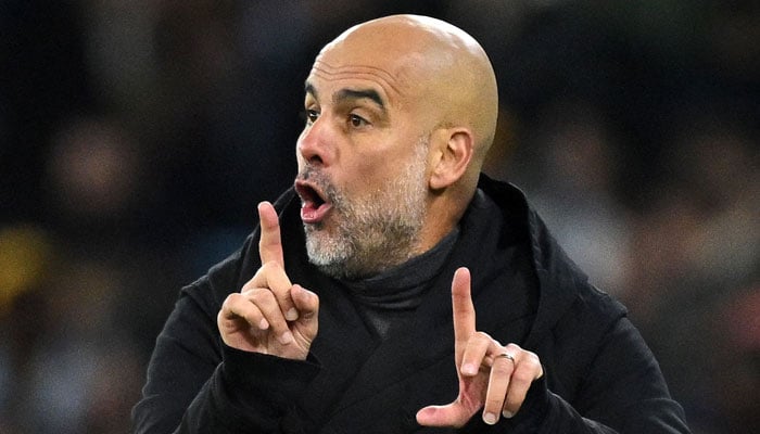 Manchester City´s Spanish manager Pep Guardiola gestures during the UEFA Champions League Group G football match between Manchester City and RG Leipzig at the Etihad Stadium, in Manchester, north west England on November 28, 2023. — AFP